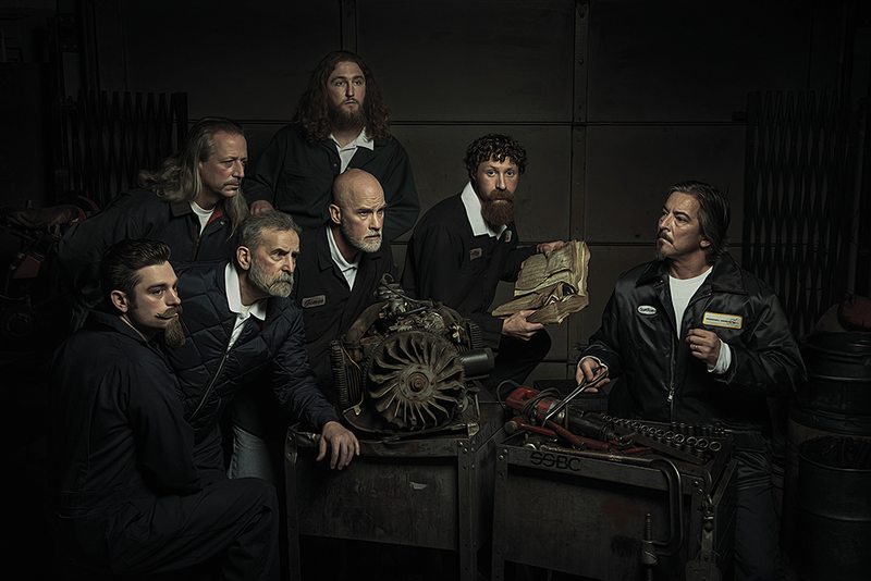 Illustration for article titled Mechanics Reenact Renaissance Paintings; Beautiful And Hilarious